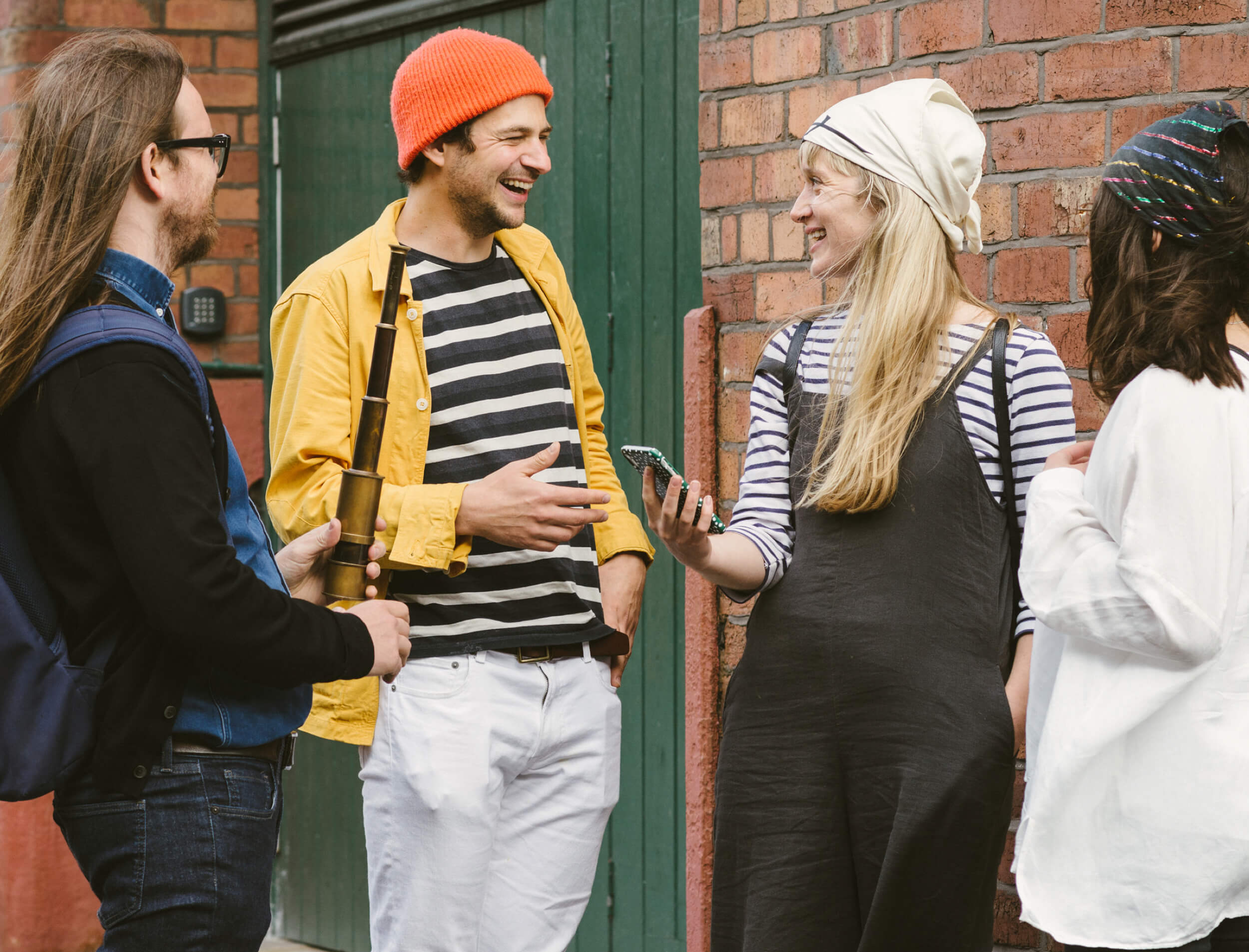 A group of friends exploring tourist attractions by playing {{< param